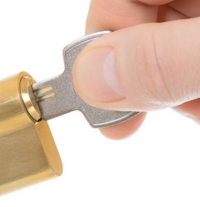 Fingers with Key in Gold Lock